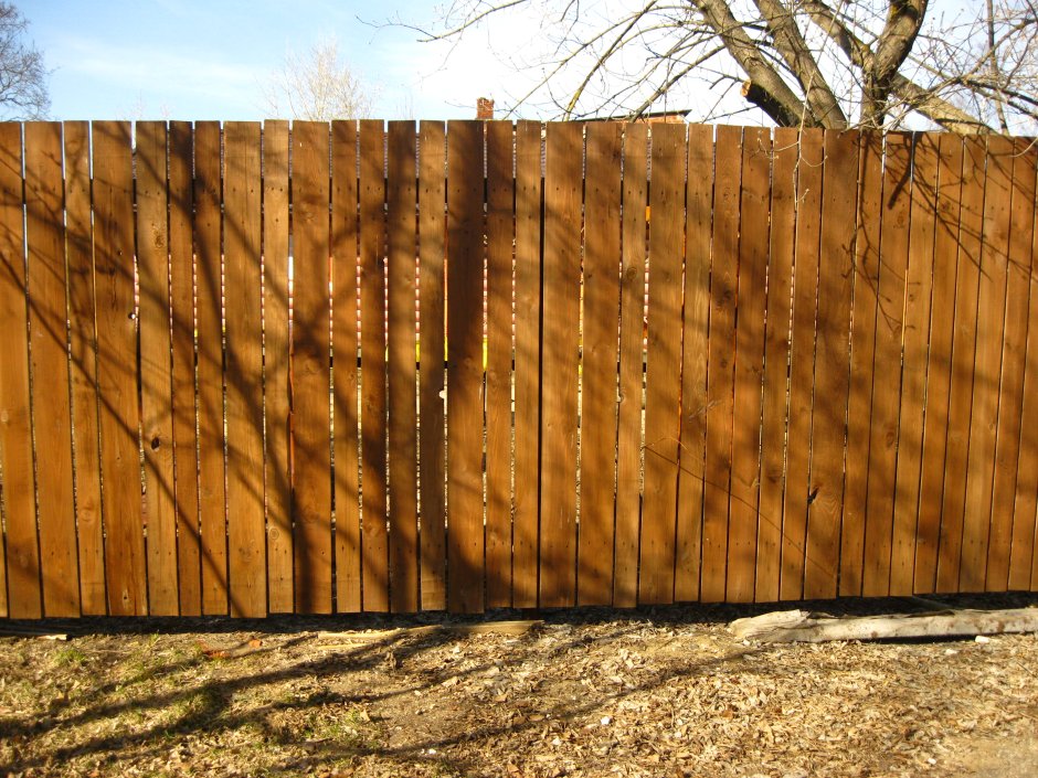 Забор из обожженной доски фото