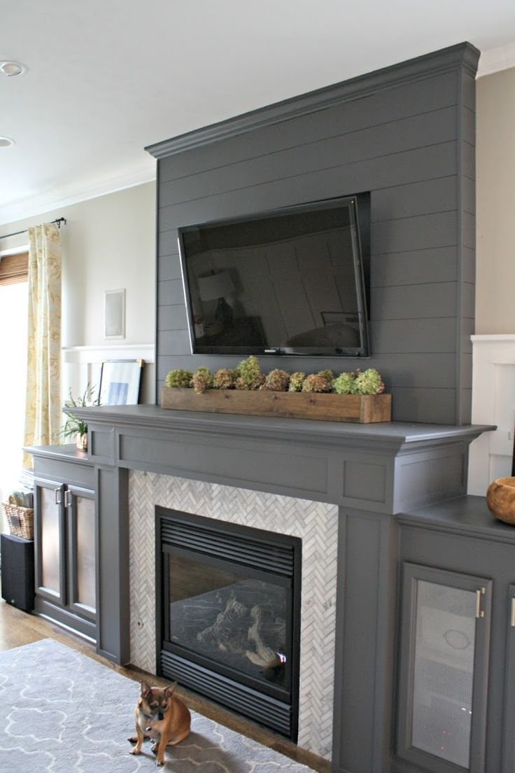 Телевизор над электрокамином в интерьере
