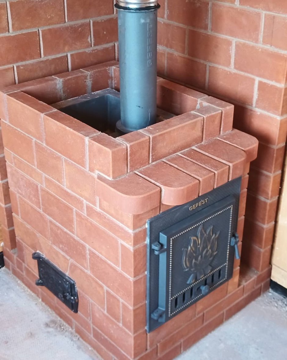 Банная печь Гефест обложенная кирпичом